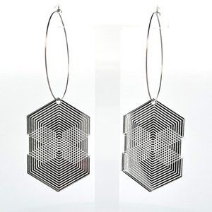 Silver Acrylic Geometric hanging earrings with large rings.